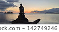 Sunset and Jizo statue 142749246