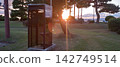 Sunset and a public telephone 142749514