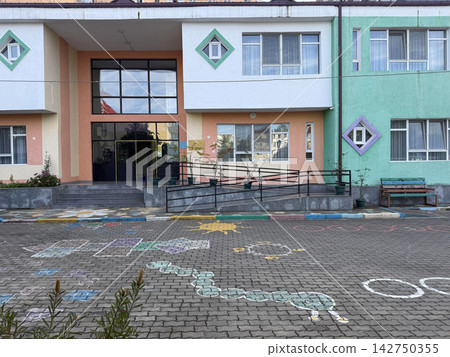 a school building with a lot of graffiti on the ground a school building with a lot of graffiti on the ground 142750355