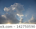 sun shining through clouds 142750590