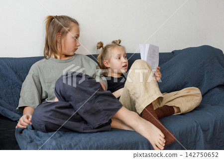 Portrait of boy and girl children learning and doing homework for school at home Portrait of boy and girl children learning and doing homework for school at home 142750652