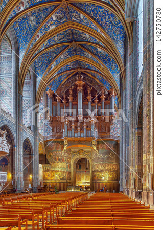 Interior view of Albi Cathedral in France showing the grand pipe organ and fresco. Gothic architecture, indoor lighting Interior view of Albi Cathedral in France showing the grand pipe organ and fresco. Gothic architecture, indoor lighting 142750780