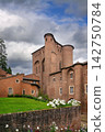 Low angle view of Berbie Palace in Albi, France. Brick architecture of Toulouse-Lautrec Museum under cloudy sky 142750784