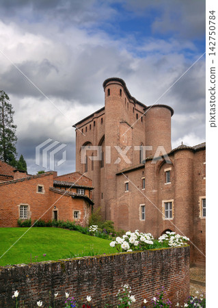 Low angle view of Berbie Palace in Albi, France. Brick architecture of Toulouse-Lautrec Museum under cloudy sky Low angle view of Berbie Palace in Albi, France. Brick architecture of Toulouse-Lautrec Museum under cloudy sky 142750784
