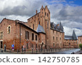 Street level view of Berbie Palace in Albi, France. Medieval fortress architecture under cloudy overcast sky 142750785