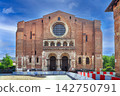 Front facade view of Basilica of Saint-Sernin in Toulouse, France. Romanesque brick architecture under day sky 142750791
