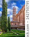 View of Jacobins Church bell tower from the cloister in Toulouse, France. Southern Gothic architecture under blue sky 142750795