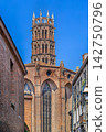 Street view of Jacobins Church apse and bell tower in Toulouse, France. Southern Gothic brick architecture under sky 142750796