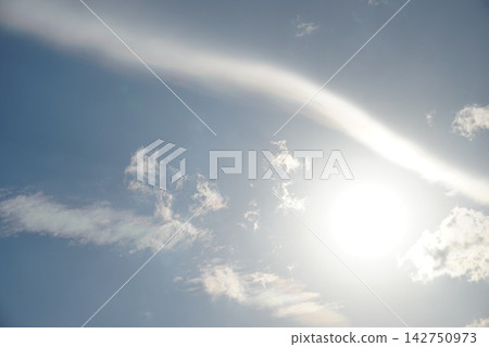 The sun visible between the sun and clouds 142750973