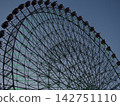 Ferris wheel gondola and blue sky and white clouds 142751110