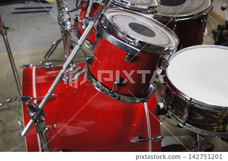 Drums are set up in a music studio with microphones attached. Drums are set up in a music studio with microphones attached. 142751201