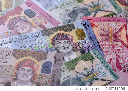 Oman, omani paper money, rial or riyal banknotes and coins as currency for exchange. Omani money Oman, omani paper money, rial or riyal banknotes and coins as currency for exchange. Omani money 142751608