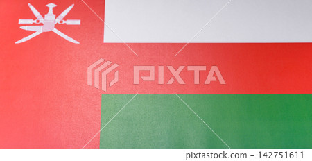 Oman, the Omani flag as a symbol of national independence. The Omani flag Oman, the Omani flag as a symbol of national independence. The Omani flag 142751611