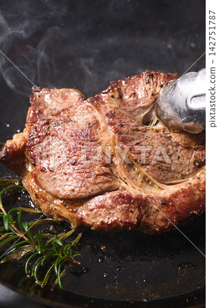 Bake steak in a frying pan Bake steak in a frying pan 142751787