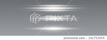 Bright lens flare effect and shimmering particles forming horizontal abstract streaks Bright lens flare effect and shimmering particles forming horizontal abstract streaks 142752054