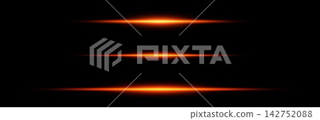 Abstract orange light streaks creating horizontal lens flares on a black background Abstract orange light streaks creating horizontal lens flares on a black background 142752088