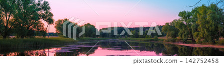 Magical pink purple sunrise over the lake. Misty morning, rural landscape, wilderness, mystical feeling Magical pink purple sunrise over the lake. Misty morning, rural landscape, wilderness, mystical feeling 142752458