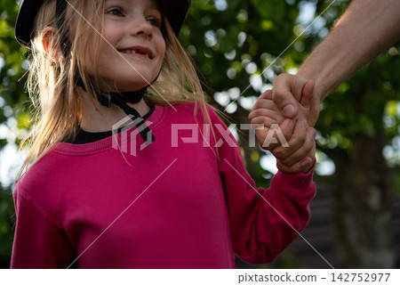 Father And Daughter Holding Hands Outdoors, Care And Family Connection Concept Father And Daughter Holding Hands Outdoors, Care And Family Connection Concept 142752977