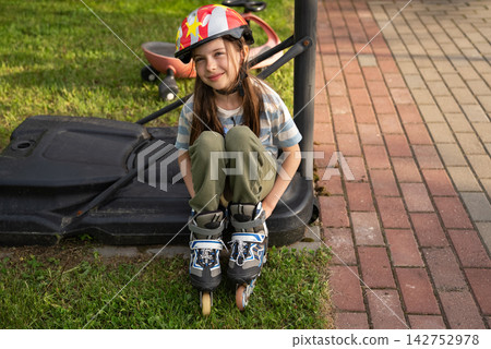 Girl Wearing Helmet During Outdoor Recreation, Active Childhood, Healthy Lifestyle And Summer Leisure Concept Girl Wearing Helmet During Outdoor Recreation, Active Childhood, Healthy Lifestyle And Summer Leisure Concept 142752978
