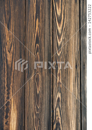 A background texture with a deep, rich wood grain and plank finish. A background texture with a deep, rich wood grain and plank finish. 142753222