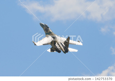A Russian Air Force Sukhoi Su-35 fighter jet climbs steeply. A Russian Air Force Sukhoi Su-35 fighter jet climbs steeply. 142753370