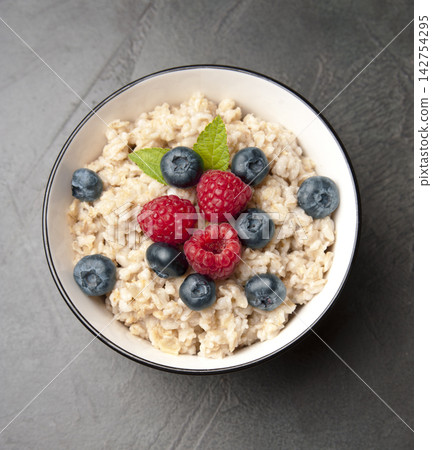 Oatmeal with berries Oatmeal with berries 142754295