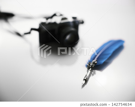 quill pen and camera on white background quill pen and camera on white background 142754634