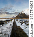 Snow-covered Vestrahorn mountain and icy landscape at Stokksnes beach, South East Iceland 142754803