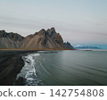 Dramatic view of Vestrahorn mountains and black sand beach at Stokksnes, South East Iceland 142754808