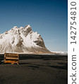 Weathered piano on the black sand of Stokksnes beach with Vestrahorn mountains in the background, South East Iceland 142754810