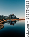 Reflection of Vestrahorn mountain in a water pool on Stokksnes beach, South East Iceland 142754813