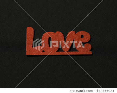 Decorative Valentine's day decorations on black background 142755023
