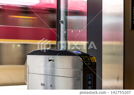 The Sunrise Seto sleeper train speeds past the automatic ticket gates, creating a sense of speed in the station platform. The Sunrise Seto sleeper train speeds past the automatic ticket gates, creating a sense of speed in the station platform. 142755207