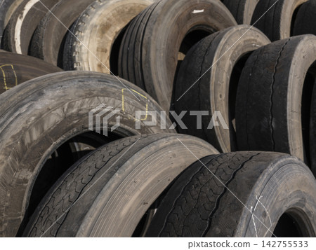 Stack of old car tires in recycling facility Stack of old car tires in recycling facility 142755533