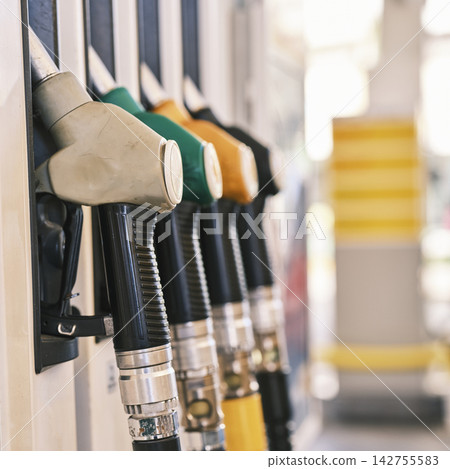 Petrol pump filling nozzles, Gas station in a service 142755583