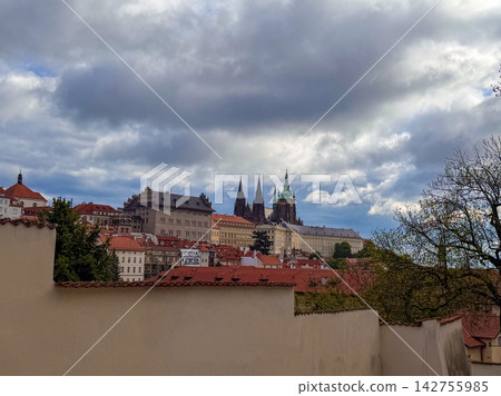 A panorama of Prague Castle with Gothic spires of St. Vitus Cathedral A panorama of Prague Castle with Gothic spires of St. Vitus Cathedral 142755985