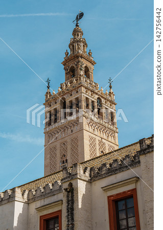 Ornate gothic gateway and bell gable at the entrance to Seville Cathedral courtyard Ornate gothic gateway and bell gable at the entrance to Seville Cathedral courtyard 142756442