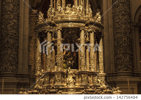 Ornate silver monstrance with sculpted saints inside Seville Cathedral treasury Ornate silver monstrance with sculpted saints inside Seville Cathedral treasury 142756484