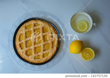 Top View of Homemade Lemon Crostata with Lemon Tea and Fresh Citrus Top View of Homemade Lemon Crostata with Lemon Tea and Fresh Citrus 142757130