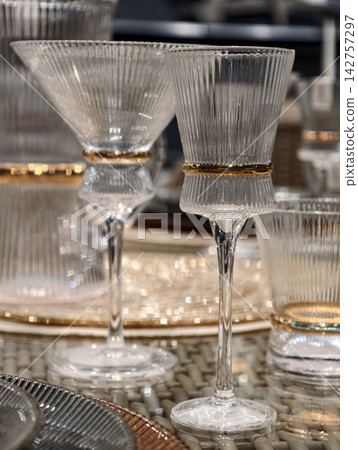 Stylish premium wine glasses placed with care on a sophisticated table Stylish premium wine glasses placed with care on a sophisticated table 142757297
