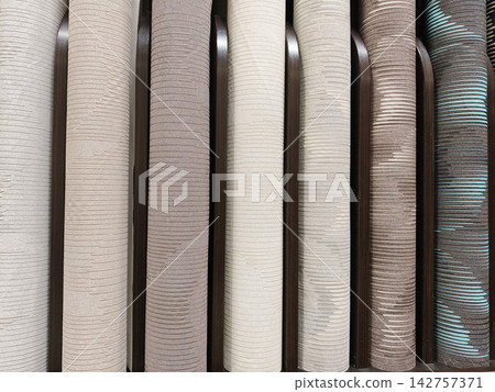 An extensive range of wallpaper rolls with diverse textures, colors, and patterns on display, ideal for all home renovation needs An extensive range of wallpaper rolls with diverse textures, colors, and patterns on display, ideal for all home renovation needs 142757371