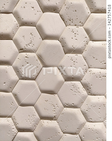 Light decorative panels replicating hexagonal tile look displayed in a hardware store aisle for contemporary interior design and wall finishing use 142757418