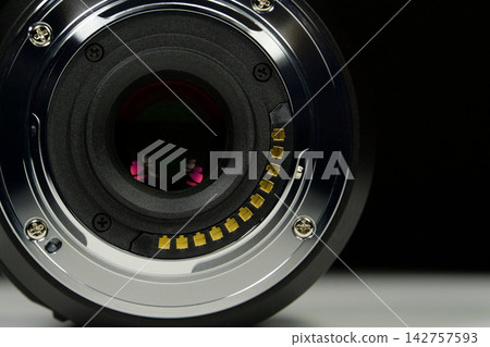 Macro lens mount of Micro Four Thirds system MFT close-up on black background Macro lens mount of Micro Four Thirds system MFT close-up on black background 142757593
