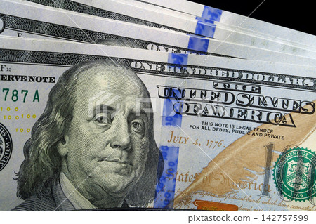 Close-up of fresh hundred-dollar bills inside a wallet, symbolizing wealth and savings Close-up of fresh hundred-dollar bills inside a wallet, symbolizing wealth and savings 142757599