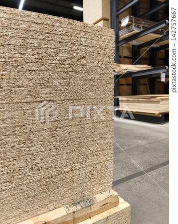 Oriented Strand Board or OSB, panel for subfloor support and wall sheathing stacked inside hardware building market 142757667