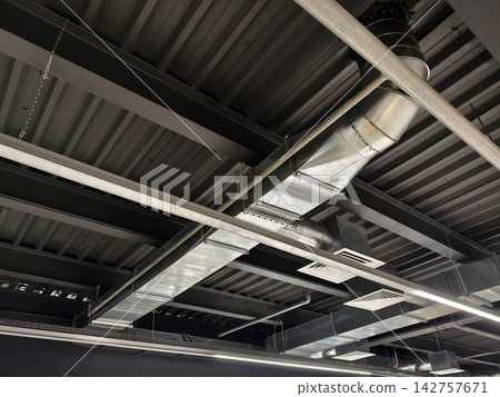 Industrial air ducts and overhead piping structure forming a complex ventilation system inside manufacturing plant Industrial air ducts and overhead piping structure forming a complex ventilation system inside manufacturing plant 142757671
