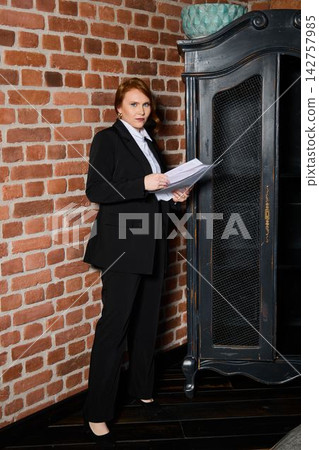 Caucasian entrepreneur rehearsing pitch with documents Caucasian entrepreneur rehearsing pitch with documents 142757985