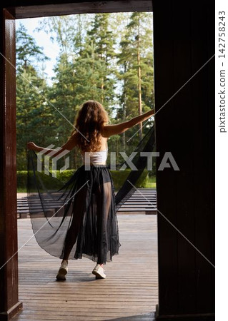 Trendy person displaying movement within outdoor environment Trendy person displaying movement within outdoor environment 142758243