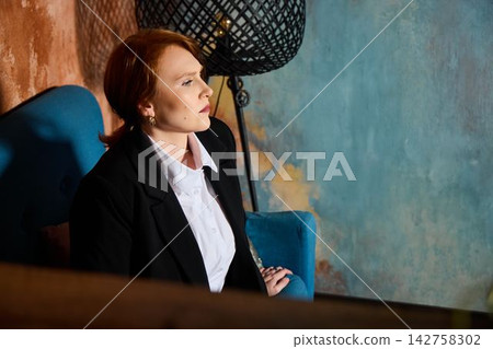 Woman sketches creatively. Relaxed woman writes next article outline Woman sketches creatively. Relaxed woman writes next article outline 142758302