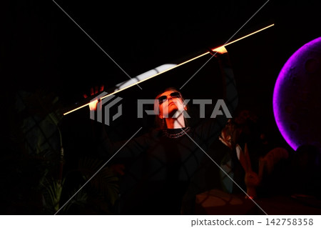 Cinematic closeup highlighting shadows and purple glow effects Cinematic closeup highlighting shadows and purple glow effects 142758358